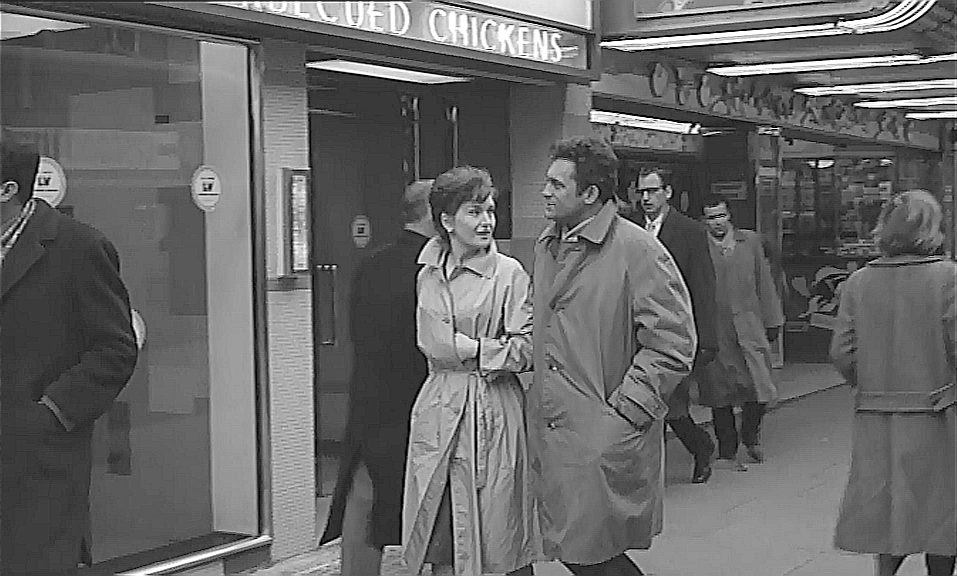 Charing Cross Road and the Jacey Cinema behind the couple Circa 1961