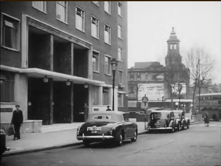 St. Giles High Street, looking east towards the Shaftesbury Theatre. Circa 1954