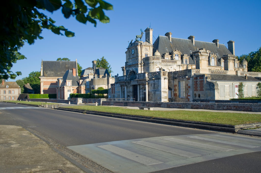 The D928 road. Place du Château, 28260 Anet, France.