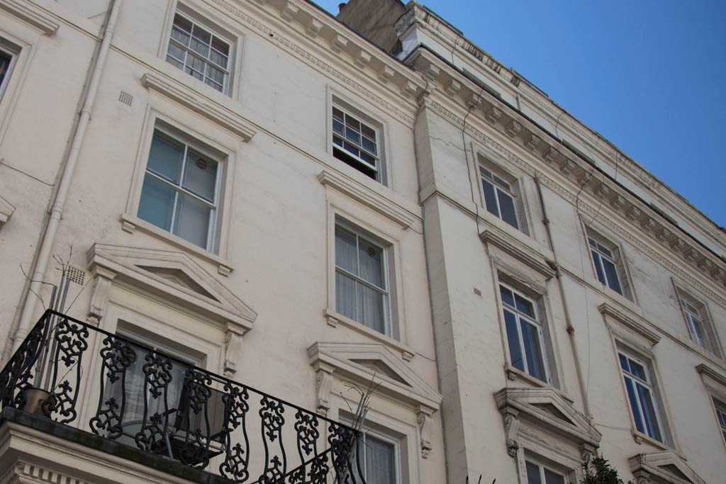 The top floors of two Victorian houses