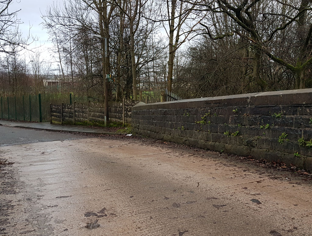 The railway bridge on Heald Road which is just off Barden Lane.