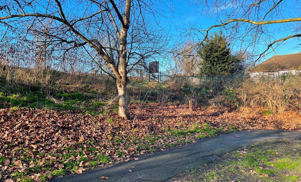 The Mostyn Road entrance to Mostyn Gardens adjacent to Martin Way, London SW19.