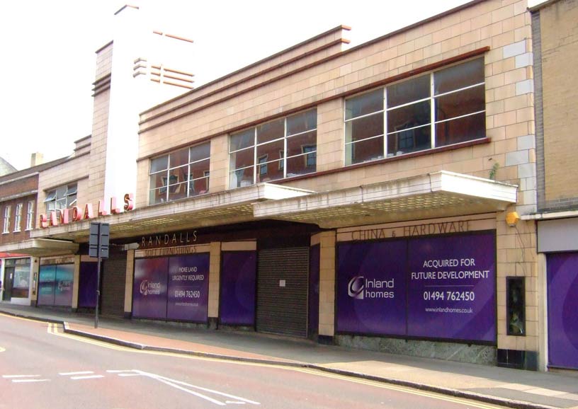 A three quarter photograph of a closed department store with pavement awnings.