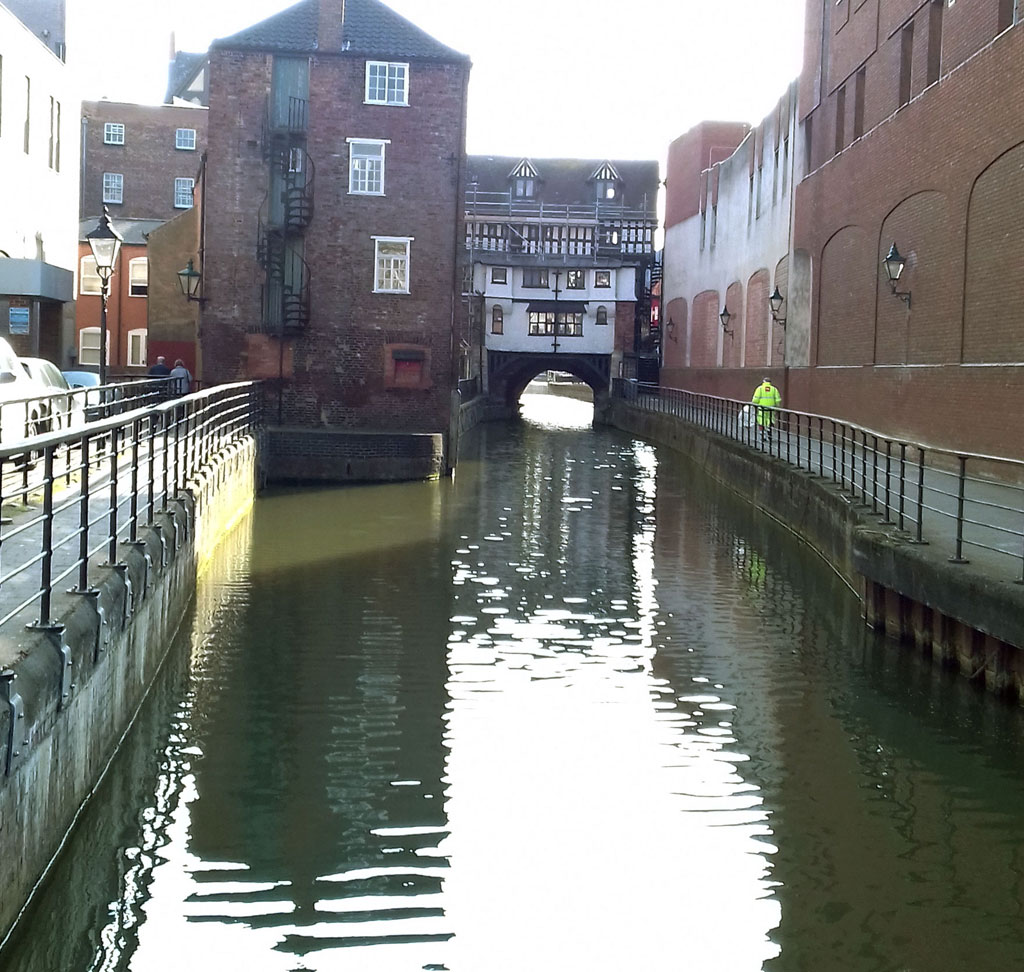 North Witham Bank with High Bridge taking High Street over the River Witham in the right distance. Known locally as 'Glory Hole'.