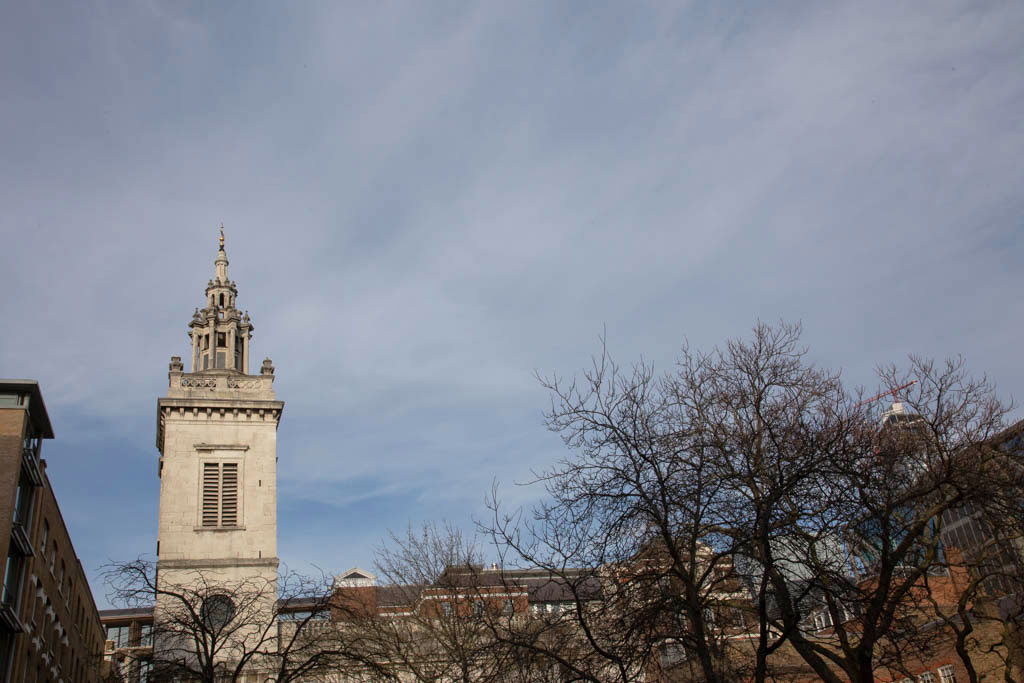 In the background stands St. Michael Paternoster Royal church on College Hill.