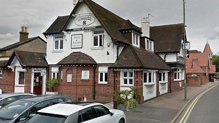 A brick and white rendered public house that is now a restaurant.