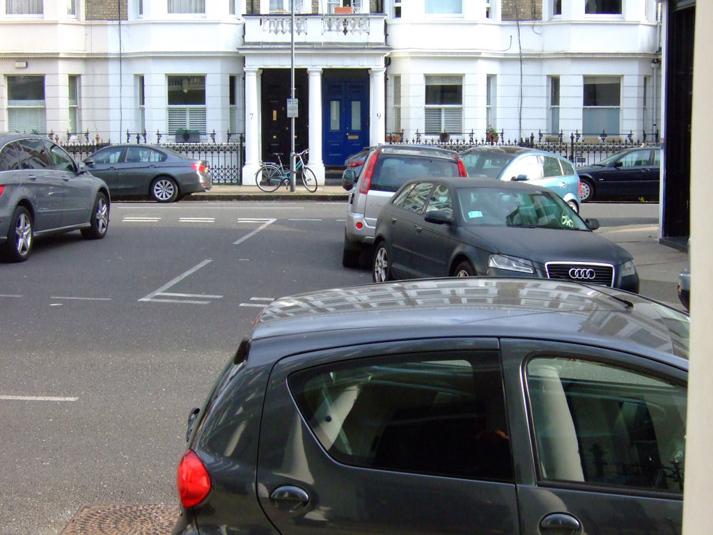 Looking onto Baron’s Court Road W14 with properties on Comeragh Road filling the background.