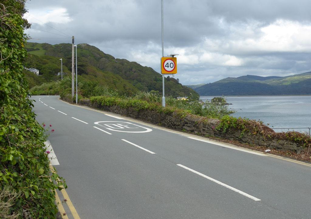 The A493 at Trefri with Trefri Lodge in the centre background.