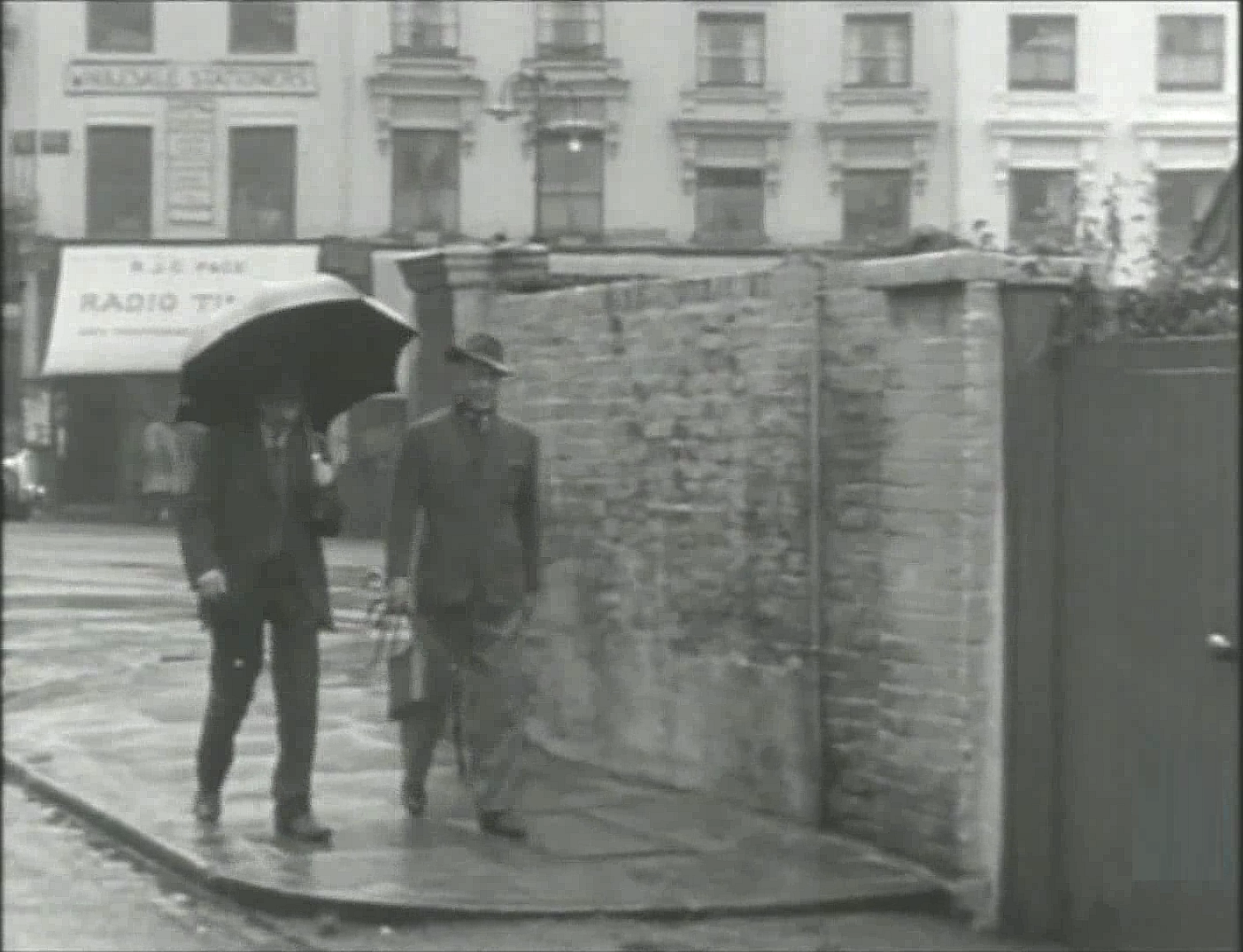 Belsize Lane with properties on Belsize Terrace crossing the background. Circa 1951