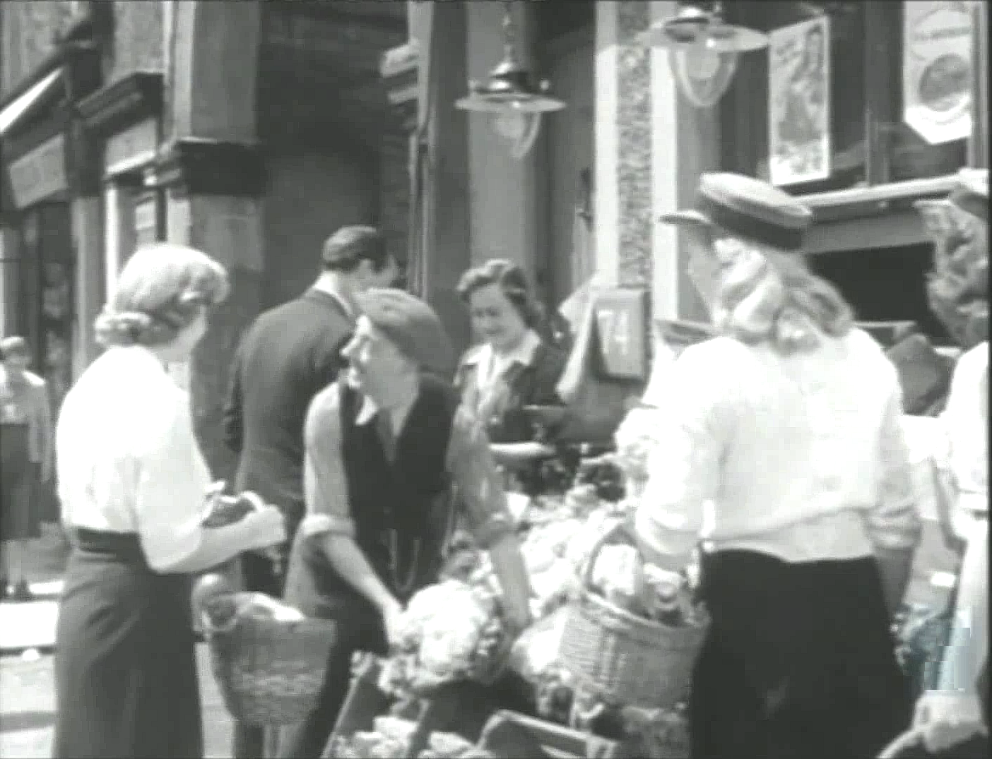 Belsize Lane with the entrance to Belsize Park Mews on the left. Circa 1951
