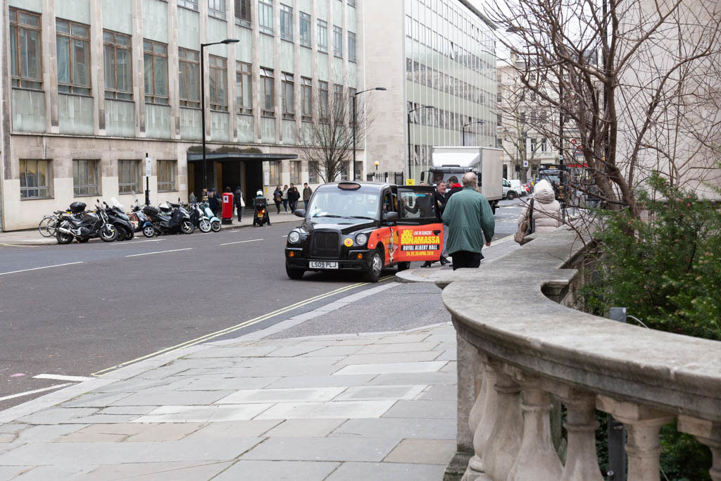 Looking along Prince Consort Road with buildings on Queen's Gate in the distance.