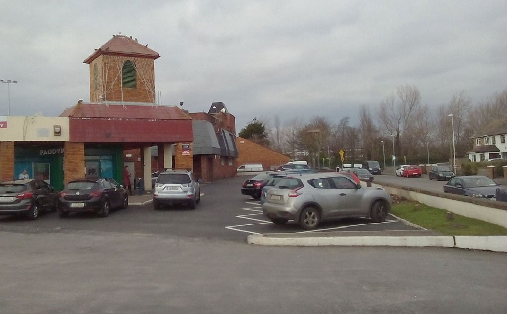 Facing Greendale Shopping Centre and the Foxhound Bar on Greendale Road.