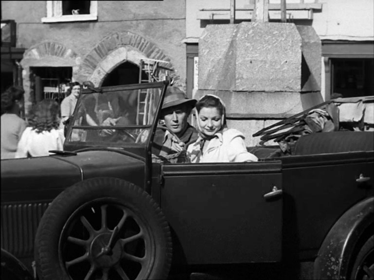 North Street, Ashburton, Devon with the Medieval Archway in the background Circa 1950