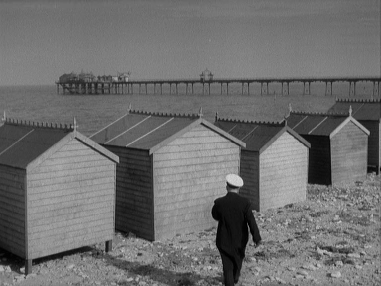 Hunstanton Pier view from the beach over beach huts Circa 1957