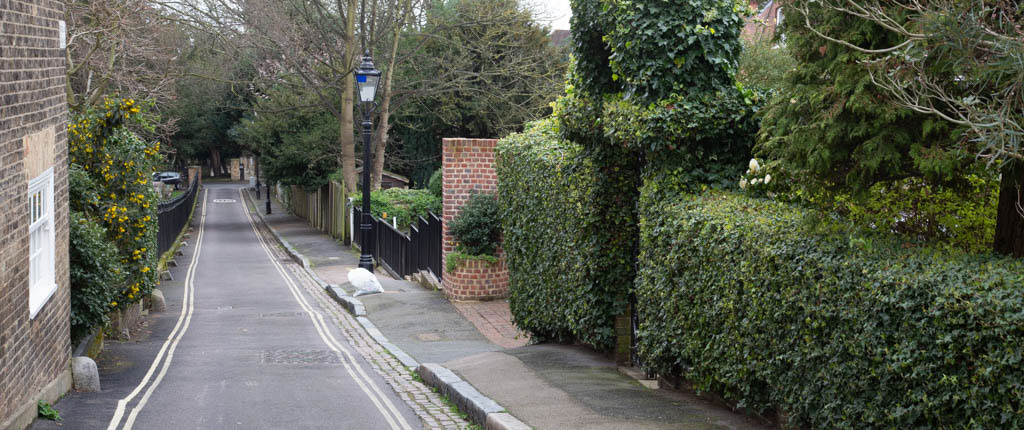 Holly Walk in London NW3 with the wall of Benham’s Place to the extreme left.
