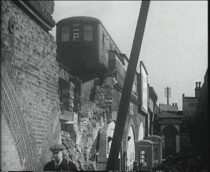 Lewisham, east of the Station where the line crosses Lewisham Road/Lewisham High Street. The location is on the south side of the track. Circa 1940