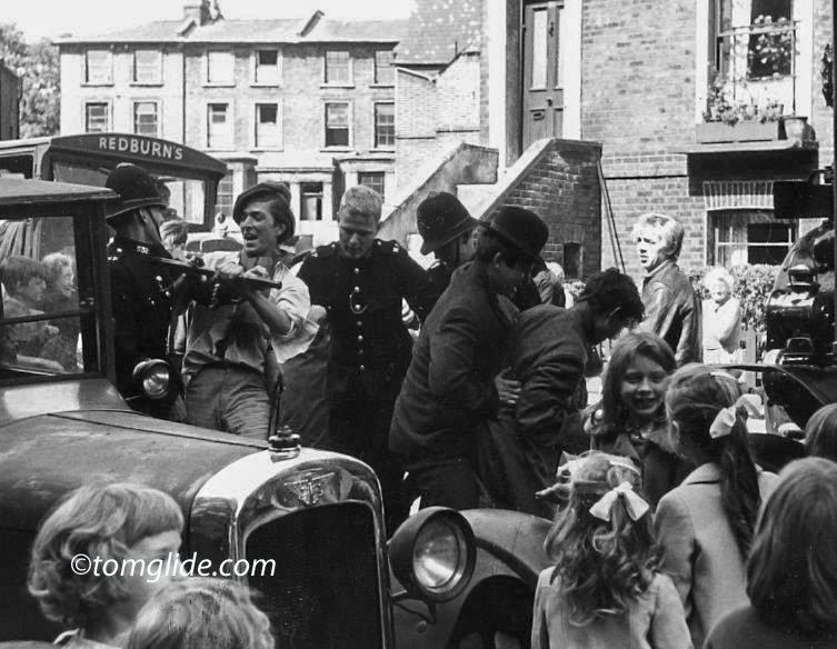Riot scene outside 31 Wrotham Road, London NW1 with houses in Elm Road in the background.