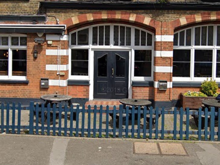 The public bar entrance to The Leather Bottle, Merton Hall Road