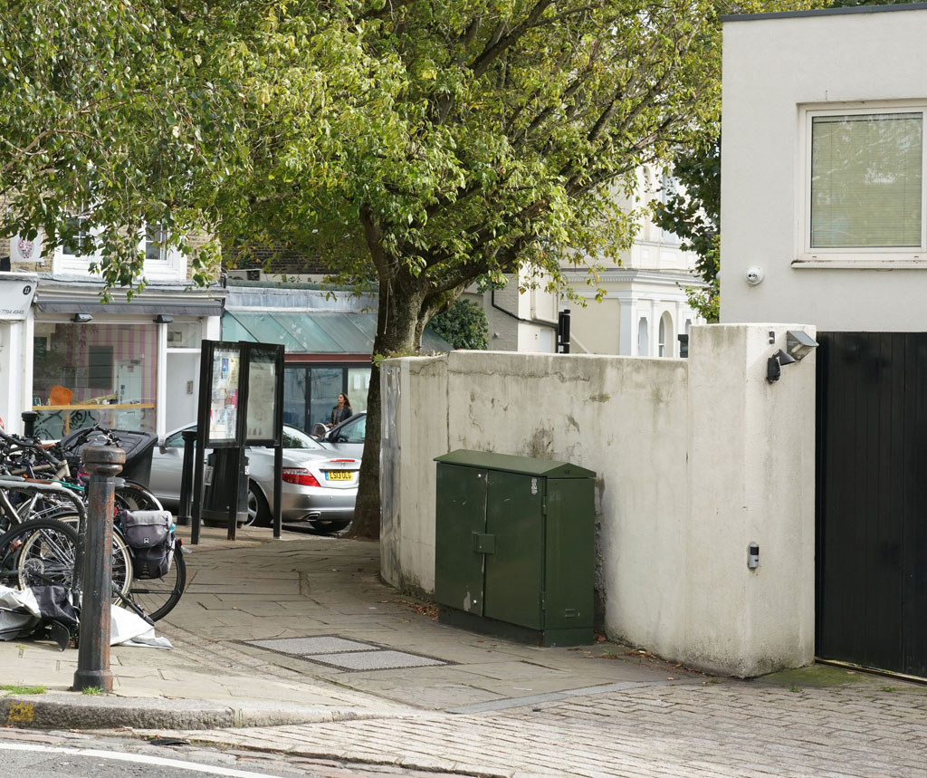 Belsize Lane with properties on Belsize Terrace crossing the background.