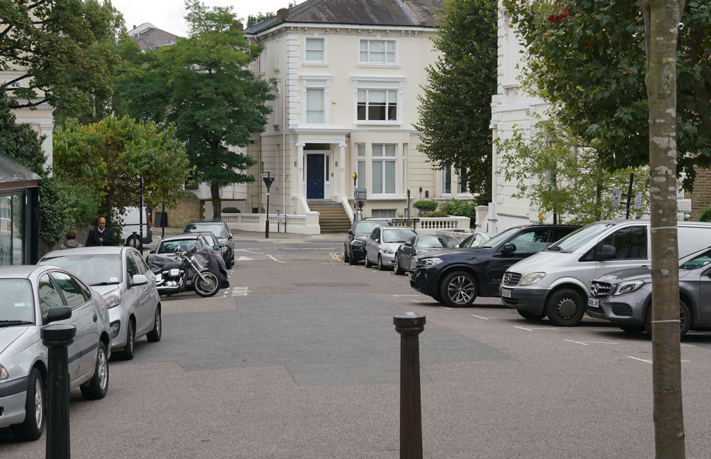 Belsize Terrace with the junction of Belsize Avenue, Belsize Park Gardens and Belsize Park ahead.