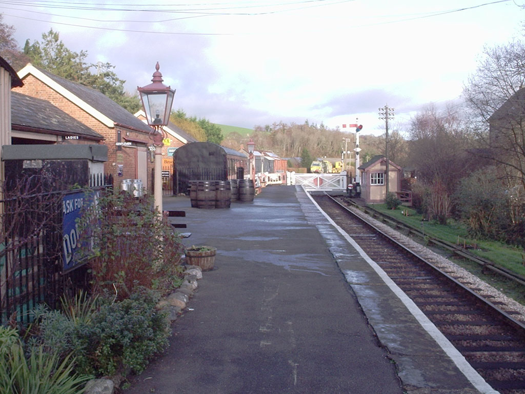 The single platform at Staverton Station looking towards the level crossing gates