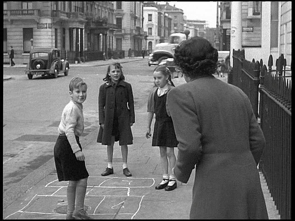 Charlwood Street looking south-west across Belgrave Road to the white curved building on Denbigh Street, SW1 Circa 1952