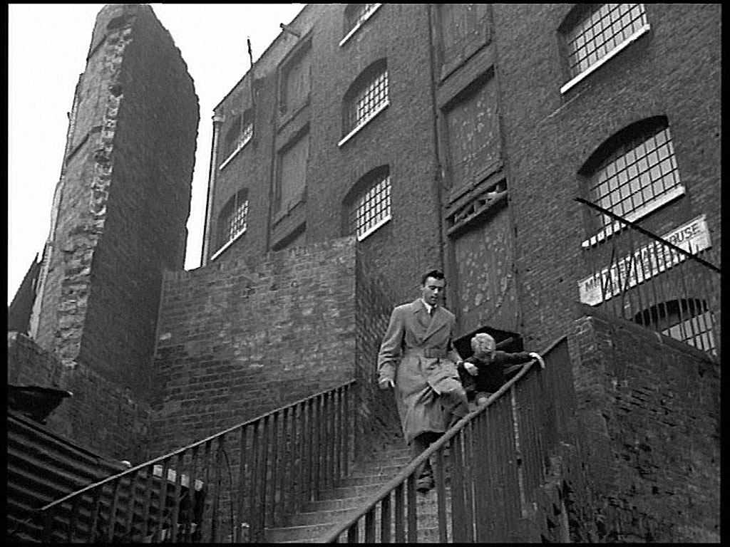 The north-west corner of St. Katharine Docks and ‘C’ warehouse left that fronted onto East Smithfield, London E1 Circa 1952