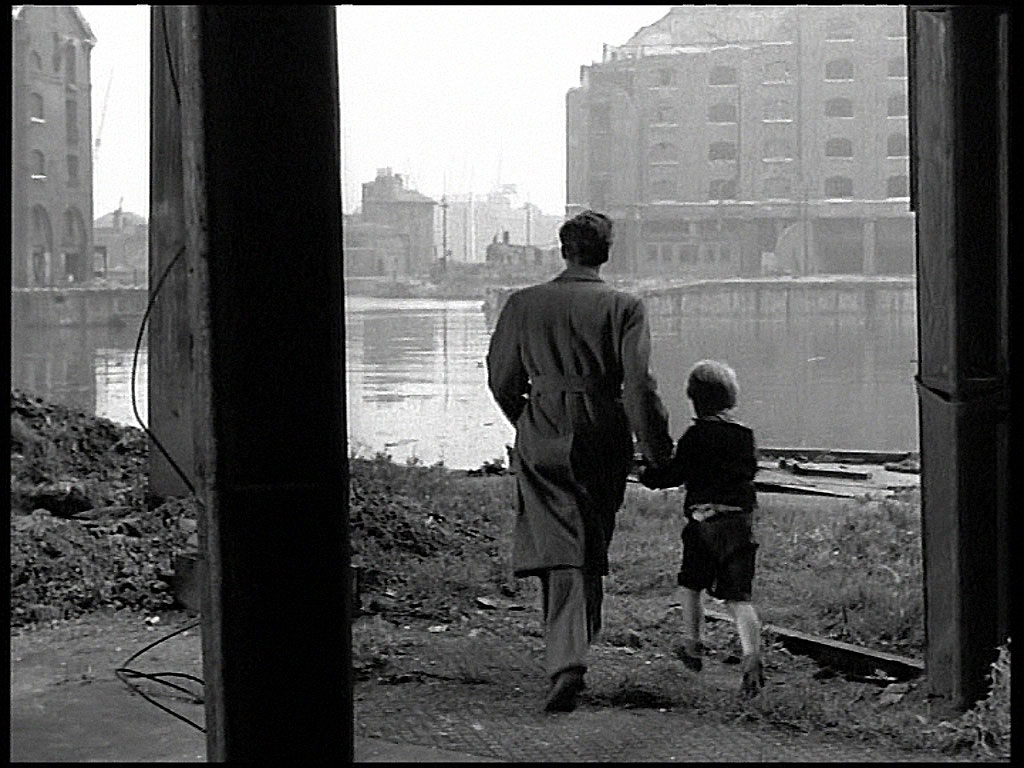 The western face of Ivory House is far left of the capture and the dock entrance is visible center distance. Circa 1952