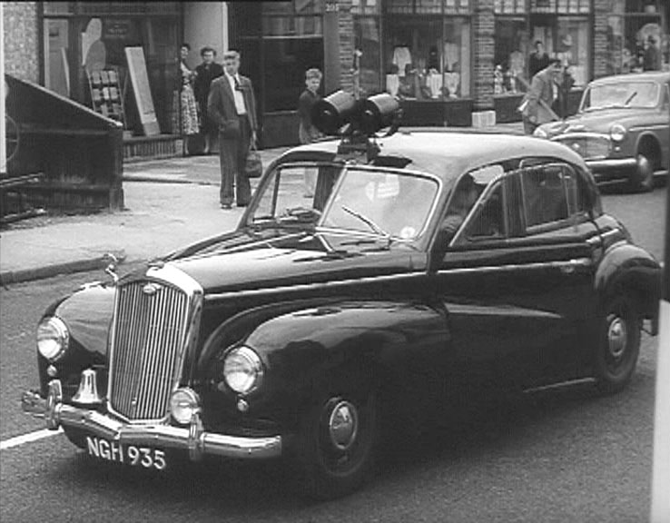 High Street, Hampton Hill, Middlesex at the junction with Hampton Road. Circa 1955