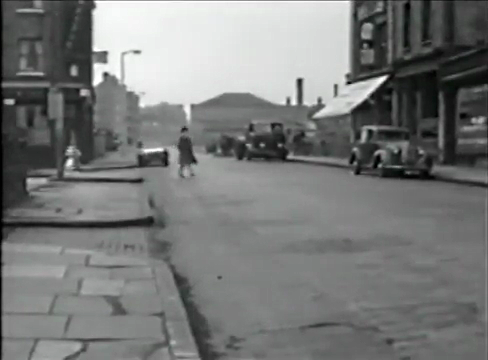 The Highway looking west with 'The Old Rose' Pub, 128, on the corner of Chigwell Hill. The shop opposite with the white awning is 173. Circa 1960
