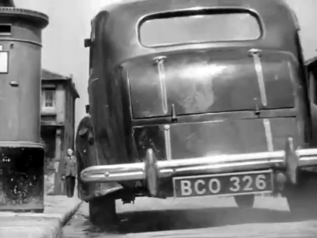 Facing west on Crisp Road, London W8 with buildings on River Terrace behind the prop letter box. Circa 1948
