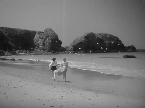 Looking south on the beach at Porthcothan Bay in Cornwall. Circa 1937