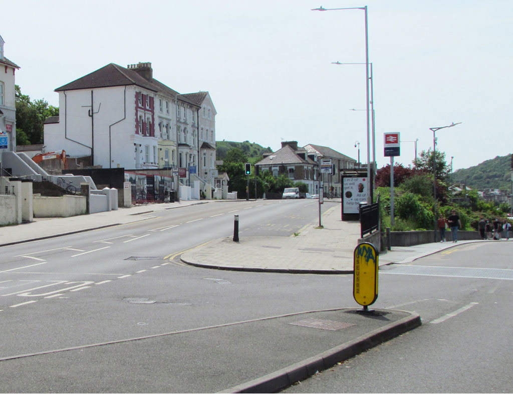 Folkestone Road with Priory Station Approach Road to the right.