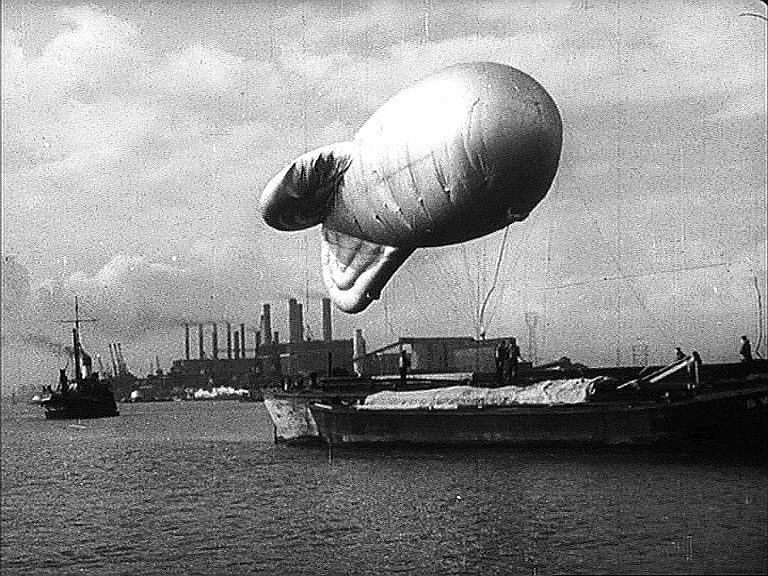 The Thames, a barrage ballon with Barking Power Station, Creekmouth, Essex Circa 1942