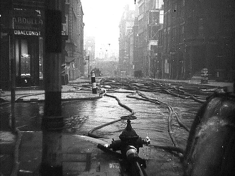 Queen Street EC4 looking towards Southwark Bridge with Cannon Street on the left. Circa 1942