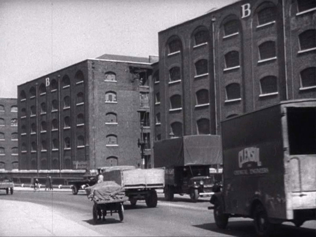 Tower Bridge Approach, London E1 looking north at ‘B’ warehouses of St Katharine Dock. Circa 1942
