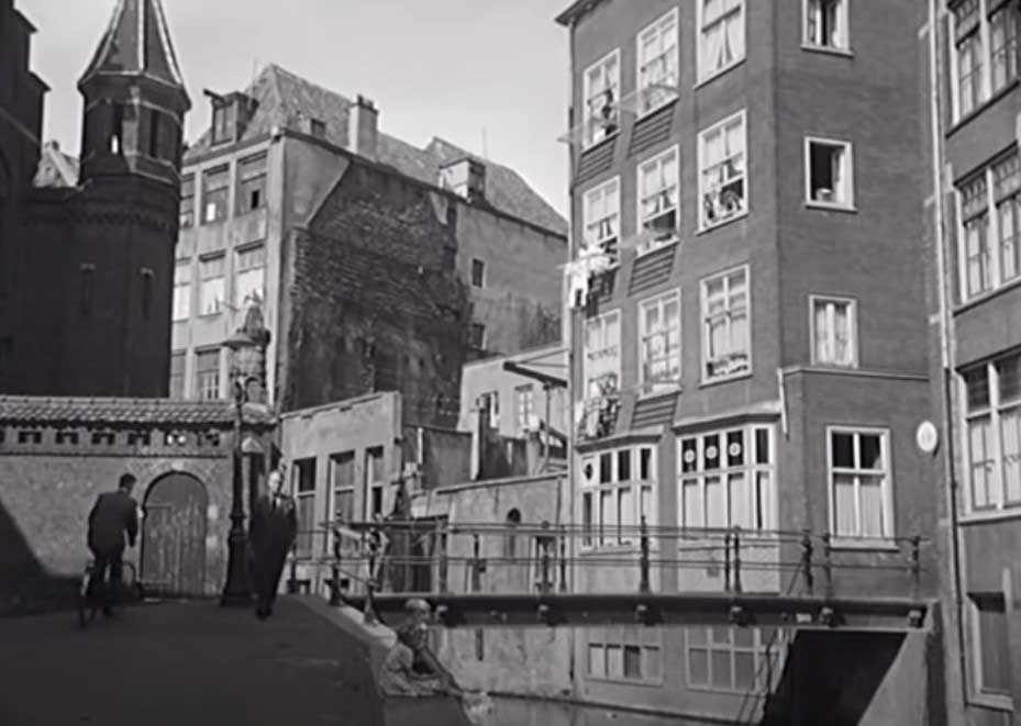 Oudezijds Achterburgwal and we are looking at the pedestrian Vredenburgerbrug at the Spooksteeg, Amsterdam Circa 1955