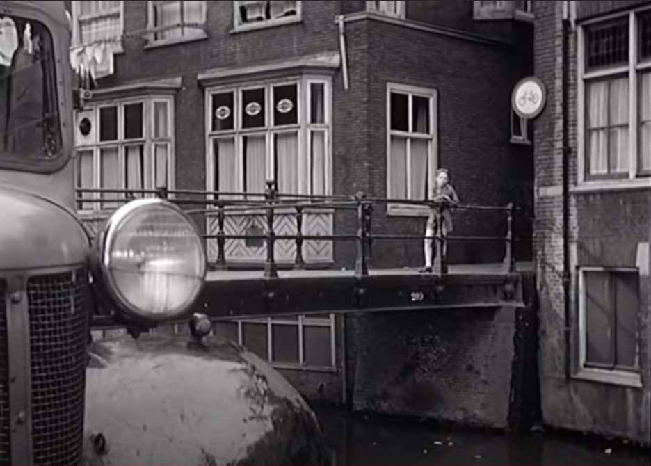 Oudezijds Achterburgwal and we are looking at the pedestrian Vredenburgerbrug at the Spooksteeg, Amsterdam Circa 1955