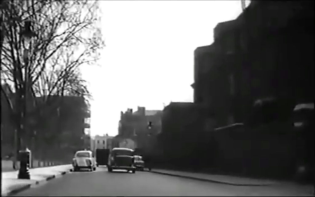 Looking south in Vincent Square. The rear of Rochester Row police station is to the right. Circa 1959