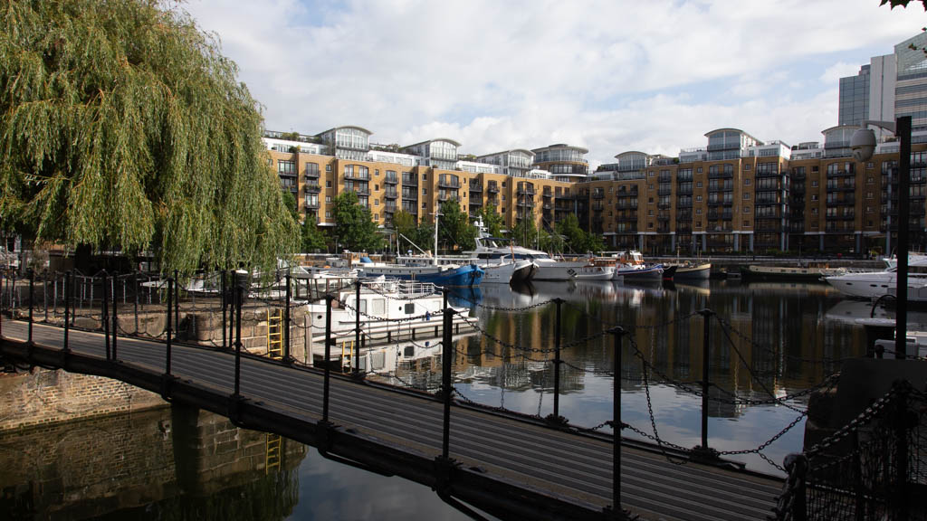 Looking across East Dock, St Katharine Docks, London E1, over Thomas More Street to the entrance to London Docks and associated warehouse(s)