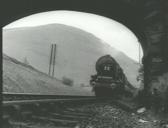 LMS express rounding a curve in the Lune Gorge, Cumbria, Lancs. Circa 1941