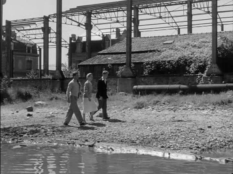 Deauvill, France and properties either side of Rue Jules Ferry junction with Quai de la Touques in the background Circa 1954