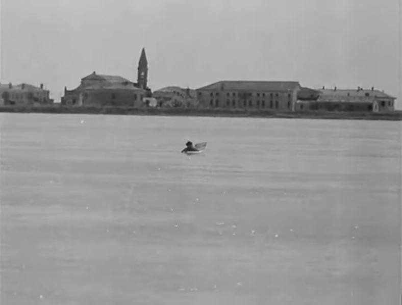 View across the Po river towards the village of Tolle, located in the municipality of Porto Tolle, where the campanile of the original parish church can be seen. Circa 1946