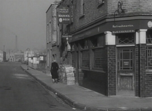 Looking north up Exmouth Street towards the properties on Smithy Street. Circa 1949 'Prince Albert' 83 Clark Street, E1 to the right.
