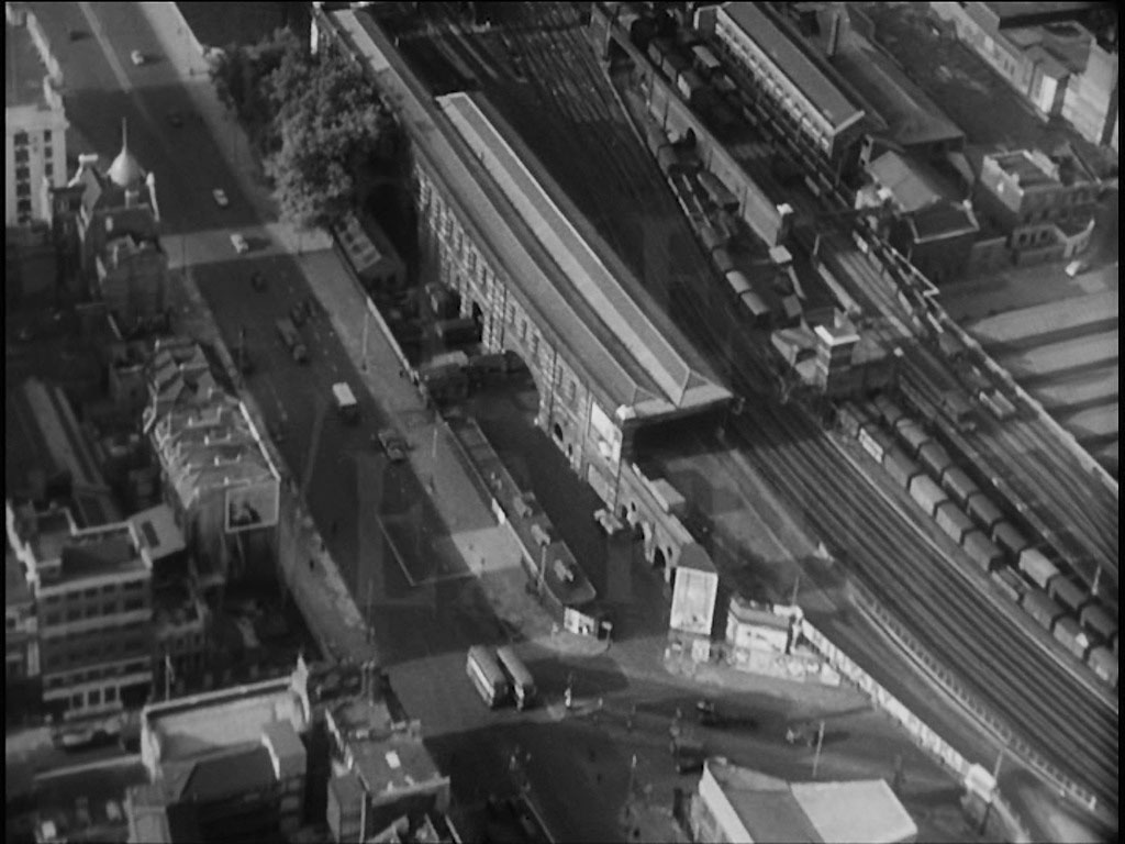 Aerial view of London. Road traffic is seen on Blackfriars Road and to its right a British Rail Goods Station. The many lines taking both goods and passenger traffic to Blackfriars and Holborn Viaduct Stations. Circa 1956