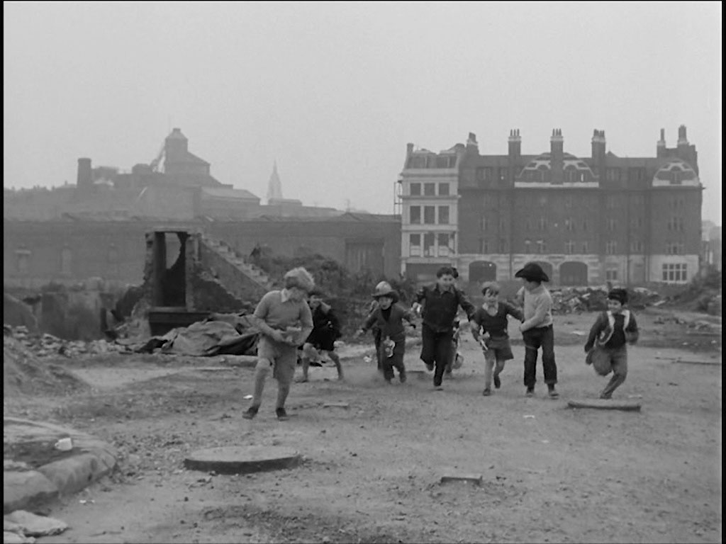 Jewin Street looking towards Red Cross Street/Fore Street, EC2 Fire Station in the background. The Whitbead Brewery, Chiswell Street, EC1 the the left distant background. Circa 1956
