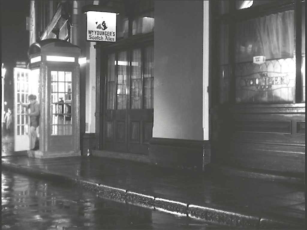 New Row at the junction of Garrick Street, WC2, the ‘White Swan’ public house to the left and ‘The Round House’ pub on the right. Circa 1956