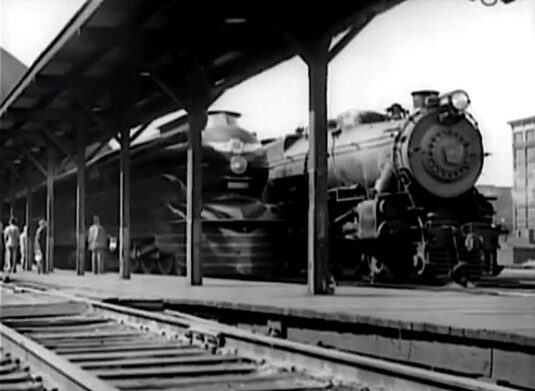 Pennsylvania (Penn) Station in Pittsburgh with the locomotive facing east. PRR K4 locomotive No 3768 streamlined ‘Torpedo’ style, with 5477 behind. Circa 1941