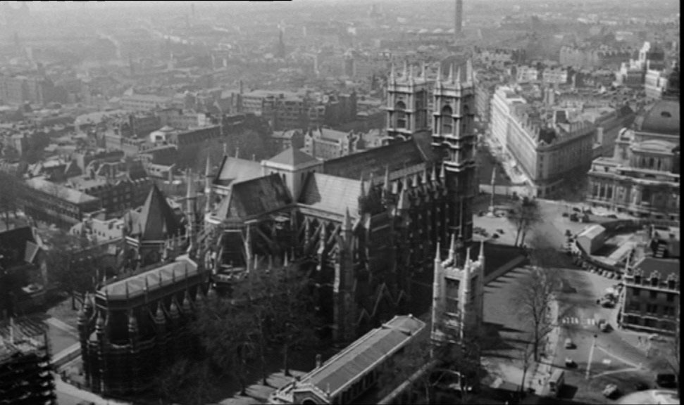 An aerial view of London with Westminster Abbey dominating the capture, looking as though the shot was taken from Elizabeth Tower. Circa 1961