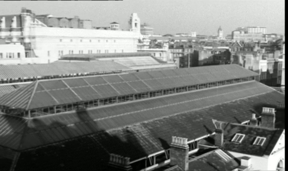 Looking north over Covent Garden Market, the tower of United Grand Lodge of England, Great Queen Street, WC2 center mid-ground. Circa 1961